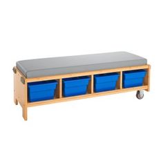 a wooden bench with three blue bins on it's sides and two gray trays under the seat