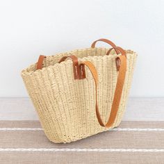 IN STOCK. FAST SHIPPING FROM LOS ANGELES. 3-5 DAYS Chic simple straw woven tote bag perfect for all occasions.Size approximately 16 inches opening wide x9.5 inches tallShort handle 8.5 inches.Long handle 15 inches Designer Style ID: 8580 Palm Leaf Beach Bag With Braided Handles For Shopping, Natural Rectangular Beach Bag With Leather Handles, Rectangular Palm Leaf Beach Bag For Travel, Rectangular Straw Bag With Leather Handles For Beach, Straw Beach Bag With Leather Handles For Shopping, Woven Straw Bag With Double Handles, Rectangular Bucket Bag With Braided Handles In Natural Color, Summer Rectangular Straw Bag With Rolled Handles, Beige Rectangular Beach Bag With Rolled Handles