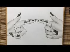 two hands with black and white nail polish holding the words best friends