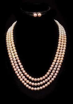 Introducing our luxurious Freshwater Multicolor Pure Pearl Necklace and Earring Set, a masterpiece of elegance and sophistication. This stunning set features three strands of perfectly matched freshwater pearls, each carefully selected for their radiant luster and harmonious color gradient. The pearls transition beautifully from creamy white at the clasp to rich pinks and soft peach tones, creating a visually captivating effect. The necklace is secured with a durable and elegant gold clasp, ensuring a secure and comfortable fit. The set is complemented by a pair of matching pearl stud earrings, featuring the same exquisite pearls for a cohesive and polished look. These earrings are designed with a secure post and backing, making them perfect for everyday wear or special occasions. This Tri Pearl Necklace And Earring Set, Multicolor Necklace, Peach Tones, Color Gradient, Necklace And Earring Set, Freshwater Cultured Pearls, Pearl Stud Earrings, Pearl Color, Pearl Size