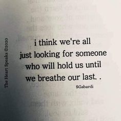 an open book with the words i think we're all just looking for someone who will hold us until we breathe our last