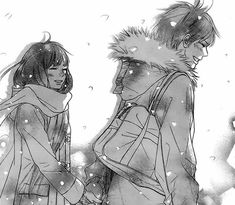 two people standing next to each other with snow falling on them and one holding the hand of another person's shoulder