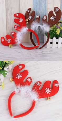 two red reindeer headbands with white snowflakes on them