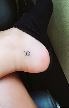 a person with a small tattoo on their foot