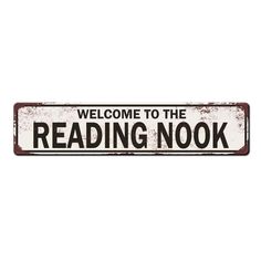 a metal sign that says welcome to the reading nook on an isolated white background