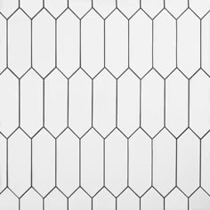 a white tiled wall with black lines on it