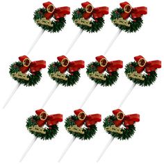 six christmas wreath lollipops with red bows and gold decorations on them, set of 12