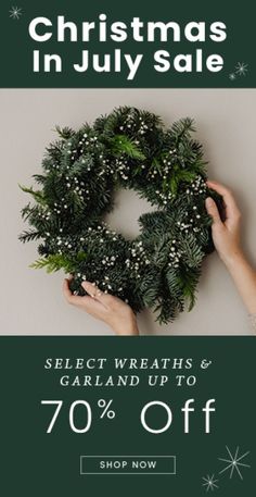 two hands holding a wreath with the words christmas in july sale on it and 70 % off