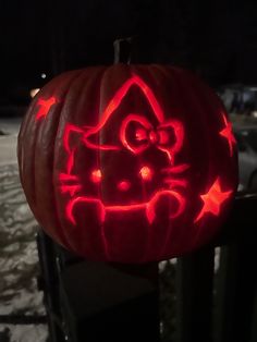 a hello kitty pumpkin carved into the shape of a house