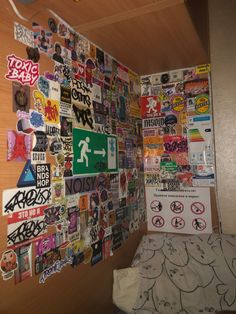 a bedroom with lots of stickers on the wall