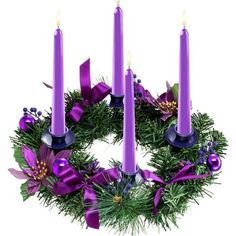 a wreath with purple candles on it