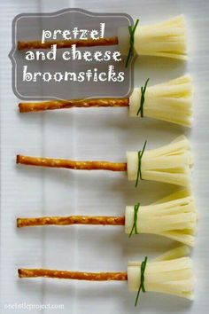 four pieces of cheese are arranged in the shape of toothpicks