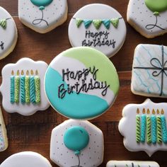 decorated birthday cookies on a wooden table