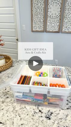 kids'gift idea arts and crafts kit in plastic container on marble countertop with text overlay that says kids'gift idea arts and crafts kit