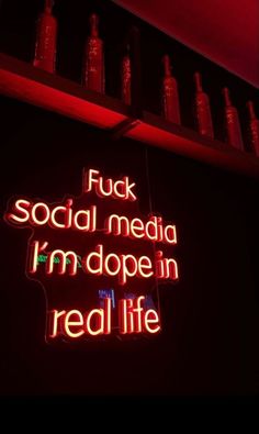 a neon sign that reads fuk social media i'm dope in real life