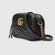 Description The small GG Marmont chain shoulder bag has a softly structured shape and a zip top closure with the Double G hardware. The chain shoulder strap has a leather shoulder detail. Made in matelassé leather with a chevron design and GG on the back. Size: 9.5″W x 5″H x 3″D / 24 x 13 x 7cm 100% genuine materials, matching the quality of the Gucci product; Black matelassé chevron leather with GG on the back Antique gold-toned hardware Double G Interior open pocket Chain shoulder strap with 2 Gg Marmont Matelassé Mini Bag, Gg Marmont Small Matelassé Shoulder Bag, Gg Marmont Small Shoulder Bag, Gucci Gifts, Gucci Gg Marmont, Black Leather Crossbody Bag, Gg Marmont, Gucci Belt, Gucci Handbags