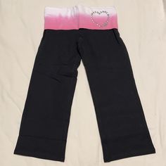 New Without Tags. Black Yoga Pants With Pink And White Tie Dye Foldover Waistband. Heart Studs And Pink Logo On Front Left Of Waistband. 13.5” Across Waist. 20.5” Inseam. 7.5” Leg Opening. Pink Cotton Activewear Long Pants, Pink Yoga Pants With Elastic Waistband, Pink Fitted Yoga Pants With Elastic Waistband, Fitted Pink Yoga Pants With Elastic Waistband, Pink High Waist Stretch Sweatpants, Pink Wide Leg Sports Bottoms, Casual Pink Wide Leg Leggings, Pink Fitted Casual Capris, High Waist Pink Yoga Pants With Elastic Waistband