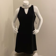 Just Taylor: Sleeveless, Black , Dress Has A 5 Row Faux Pearl Necklace Around The Collar. The Dress Closes On The Back By A 10 1/2" Zipper & 2 Matching Buttons Around The Neck. Excellent Condition. Elegant Stretch Sleeveless Dress For Formal Occasions, Classic Sleeveless Stretch Dress, Elegant Formal Stretch Sleeveless Dress, Classic Sleeveless Dress For Spring Party, Elegant Stretch Sleeveless Dress, Elegant Black Lined Sleeveless Dress, Elegant Stretch Sleeveless Dress With Flattering Silhouette, Elegant Stretch Sleeveless V-neck Dress, Elegant V-neck Stretch Sleeveless Dress