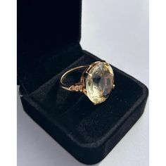 This is part of Chairish’s Fine Jewelry assortment.  Stylish Round Yellow Topaz, Vintage 14k Yellow Gold Large Cocktail Ring. Ring size 6.5 in. Stone: 19.5 mm x 19.6 mm x 10.2 mm Weight of Ring: 9.6 grams The Round cut Yellow Topaz is a large stone, estimated at 23 carats, securely set into a high rising mount that is designed to show the beauty of the gemstone.  If you would like more information, please contact me via email, mrboult@gmail.com. Elegant Formal Topaz Ring With 17 Jewels, Elegant Yellow Gold Topaz Ring For Formal Occasions, Elegant Formal Yellow Gold Topaz Ring, Classic Topaz Crystal Ring With Gemstone, Elegant Oval Yellow Gold Topaz Ring, Elegant Yellow Gold Oval Topaz Ring, Elegant Citrine Rings For Formal Occasions, Elegant Formal Citrine Gemstones, Formal Yellow Gold Topaz Ring With Diamond Cut