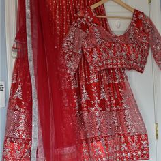 Beautiful Red Color Heavy Netted Sequence Work Lehenga Choli. Lehenga Comes With Lining And Cancan.And Heavy Beautiful Tassels. Blouse Has 3/4 Sleeves.And Back Buttons. Bust Size-36” To 38”( Extra 2” Margin) Lehenga Length-39” Heavy Netted Dupatta. Perfect For Weddings. Picture For Reference. Red Floor-length Party Set, Party Sets With Red Resham Embroidery, Elegant Red Sets For Festivals, Red Embroidered Saree For Party, Elegant Red Lehenga With Dupatta, Anarkali Party Sets In Red, Red Embroidered Sets For Navratri, Red Sets With Intricate Embroidery For Navratri, Red Bollywood Style Sets For Diwali