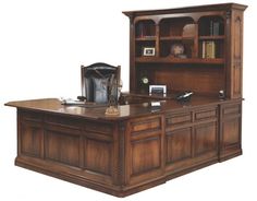 an executive desk with bookcase and chair