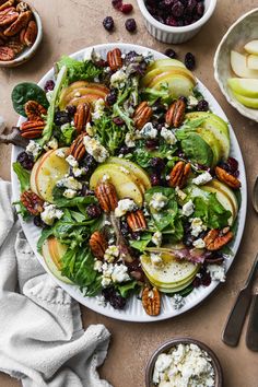 a salad with apples, blue cheese and pecans