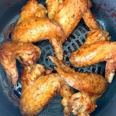 some chicken is cooking in a frying pan