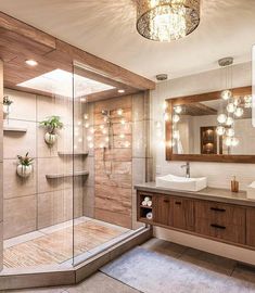 a bathroom with a walk in shower next to a sink