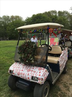 a golf cart decorated with christmas wreaths and lights