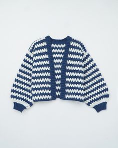 a blue and white knitted cardigan sweater