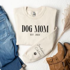 In My Dog Mom Era Custom Dog Mom Sweatshirt with Pet Name on Sleeve Dog Mama Sweatshirt Gift for Pet Lovers Custom Dog Sweatshirt ♥ PRODUCT DETAILS & SIZING This pre-shrunk, classic fit sweatshirt is made with air-jet spun yarn for a soft feel and reduced pilling. ♥ Pre-shrunk ♥ Classic fit with no center crease ♥ 1x1 athletic rib knit collar with spandex ♥ Air-jet spun yarn with a soft feel and reduced pilling ♥ Double-needle stitched collar, shoulders, armholes, cuffs, and hem: 50% preshrunk c Dog Mom Outfits, Custom Dog Sweatshirt, Hockey Mom Gifts, Puppy Mom, Dog Mama Shirt, Mama Sweater, Bulldog Shirt