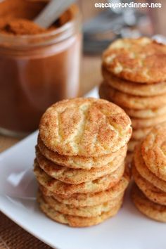 a stack of cookies sitting on top of a white plate