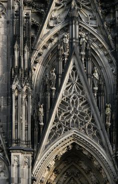 an old gothic cathedral with intricate carvings on the front