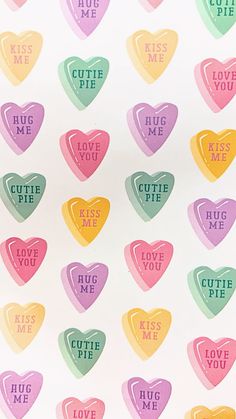 conversation hearts with the words cutie me printed on them in different colors and sizes