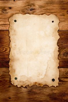 an old piece of paper on wooden background royalty photo