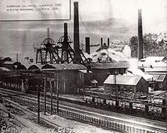 an old black and white photo of train tracks