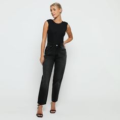 "Add some edge to your wardrobe with our black wash elasticated waist mom jeans. With a high waisted and straight leg fit, they'll make you look bold and more flattering. Made from soft denim fabric, they're also adjustable at the waist for a perfect fit. So go ahead and pair this beauty with cute tops and rock street style with confidence! Few amazing attributes: Black wash Denim fabric Straight hem High waisted Regular fitting Button and zip fly fastening Belt loops 5-pocket design Internal waist adjusters as product image Fabric: 100% Cotton Note: This Model is 5'9\" and Wears Size 8, To find the perfect fit for yourself check our Size Guide.   WOMEN'S HIGH WAISTED MOM JEANS Size = 6 - 18 Waist = 66cm - 90cm Hip = 98cm - 122cm Inside Leg = 77cm Waist is measured from All Around. Hip is Trendy Black Straight Jeans, Black Straight Leg Jeans For Work, Black Straight Leg Cropped Jeans For Work, Black Cropped Straight Leg Jeans For Work, Black High Waist Relaxed Fit Cropped Jeans, Black High Rise Cropped Jeans For Work, Black High-rise Cropped Jeans For Work, Black Denim Cropped Jeans For Work, Trendy High-rise Black Cropped Jeans