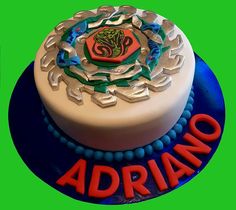 there is a cake with the name adriano on it and an image of a snake