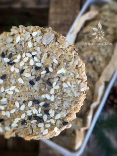 a close up of a cookie with nuts and seeds