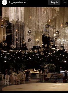 a room filled with lots of chandeliers hanging from the ceiling