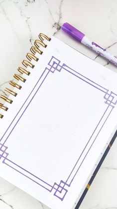 a notepad and pen sitting on top of a marble table