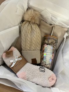 the contents of a winter gift box are neatly packed