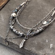 Necklace is made of oxidized silver 925 and Labradorite Dimensions: Chain 15"-20" + 1.57 " extender (38-50cm + 4 cm extender) Stones: approx. 0.08"- 0.2" (2-5 mm) Silver elements 0.08"-0.98" (2-25 mm ) The width of main element: 8.66" (22cm) The necklace in the photos is long 16 inches (41 cm) - weight 17 g Form012 COLECTION : https://www.etsy.com/shop/studioformood?ref=shop-header-name&listing_id=1744402857&from_page=listing&search_query=form012 All jewelry designs, pictures and descriptions be Artisan Necklace Sterling Silver, Minimalist Silver Necklace With Labradorite, Minimalist Silver Labradorite Necklace, Silver Hand Forged Labradorite Necklace, Silver Labradorite Hand Forged Necklace, Hand Forged Silver Labradorite Necklace, Handwriting Necklace Custom, Circle Charm Necklace, Signature Necklace