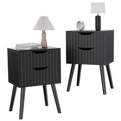 two black nightstands with one lamp on top and the other turned off to look like it is made out of wood