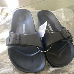 New With Tags Never Been Worn. Sandals Casual Black Footbed Sandals With Buckle Closure, Black Footbed Sandals With Buckle Closure For Beach, Casual Adjustable Black Footbed Sandals, Casual Black Adjustable Footbed Sandals, Black Synthetic Footbed Sandals For Vacation, Casual Black Synthetic Footbed Sandals, Women's Shoes Sandals, Shoes Sandals, Size 7