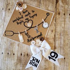 a graduation cap that has been decorated with scissors and other items on it, along with a ribbon