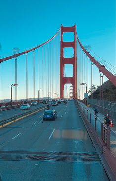 cars driving over the golden gate bridge in san francisco