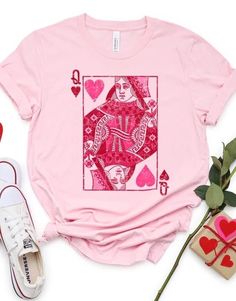 Playing with the Queen of Hearts...reminds me of an old Juice Newton song. Our tshirts/sweatshirts are available in various sizes and colors. All short sleeve shirts are Bella Canvas minus the white short sleeve shirts (Gildan) due to thickness. You are able to select the color of tshirt/sweatshirt that you would like.  A few color selections that we like are light pink, heather prism ice, white (but only in Gildan for thickness).  The long sleeve shirts and sweatshirts are the Gildan brand.  All shirts are made to order. Typically ships within 7-14 business days based on the inventory of the sweatshirts/shirts. Valentine's Day Graphic Print Top With Relaxed Fit, Valentine's Day Graphic Print Relaxed Fit Top, Pink Cotton Sweatshirt For Fan Merchandise, Pink Queen Of Hearts, Band Merch Crew Neck Top With Heart Graphic, Queen Of Hearts Shirt, Valentine's Day Graphic Print Relaxed Top, Valentine's Day Graphic Print Top, Relaxed Fit, Queen Of Hearts Sweatshirt