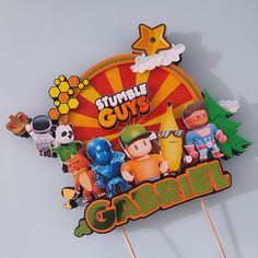 there are some cake toppers that look like cartoon characters on the sticker above them