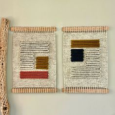 two pieces of woven art hanging on a wall